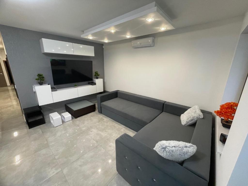 TV a/nebo společenská místnost v ubytování VRG 1 Exkluzív Apartman