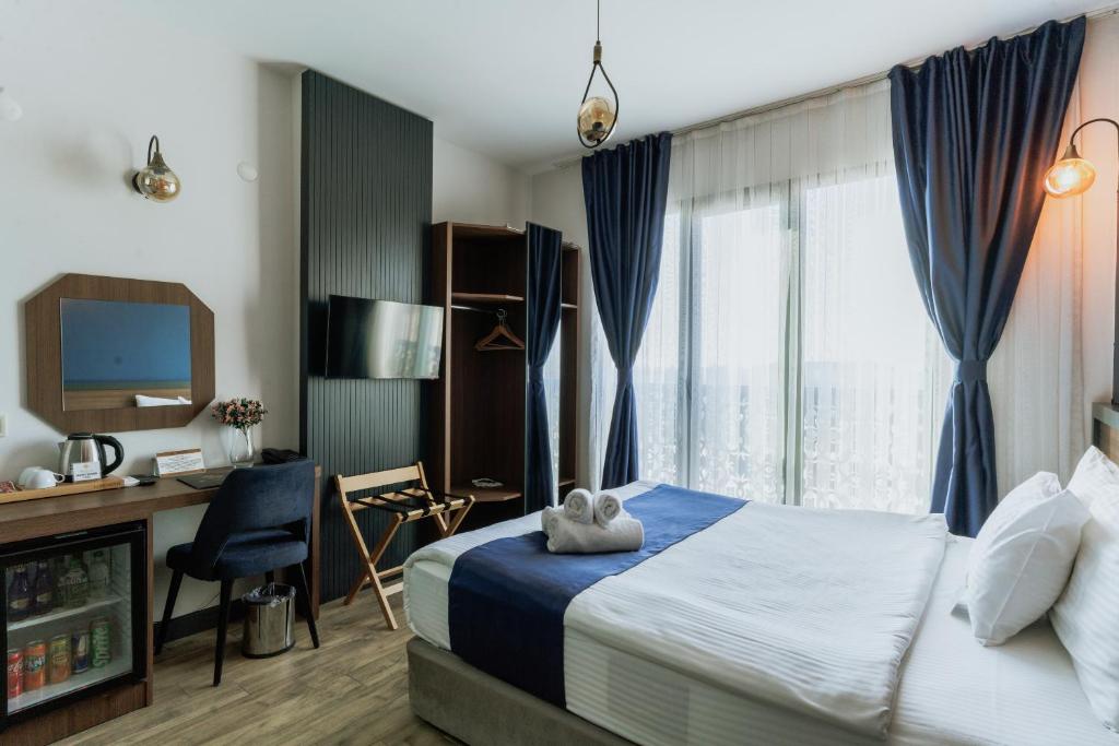 Postel nebo postele na pokoji v ubytování The Rest Port Hotel