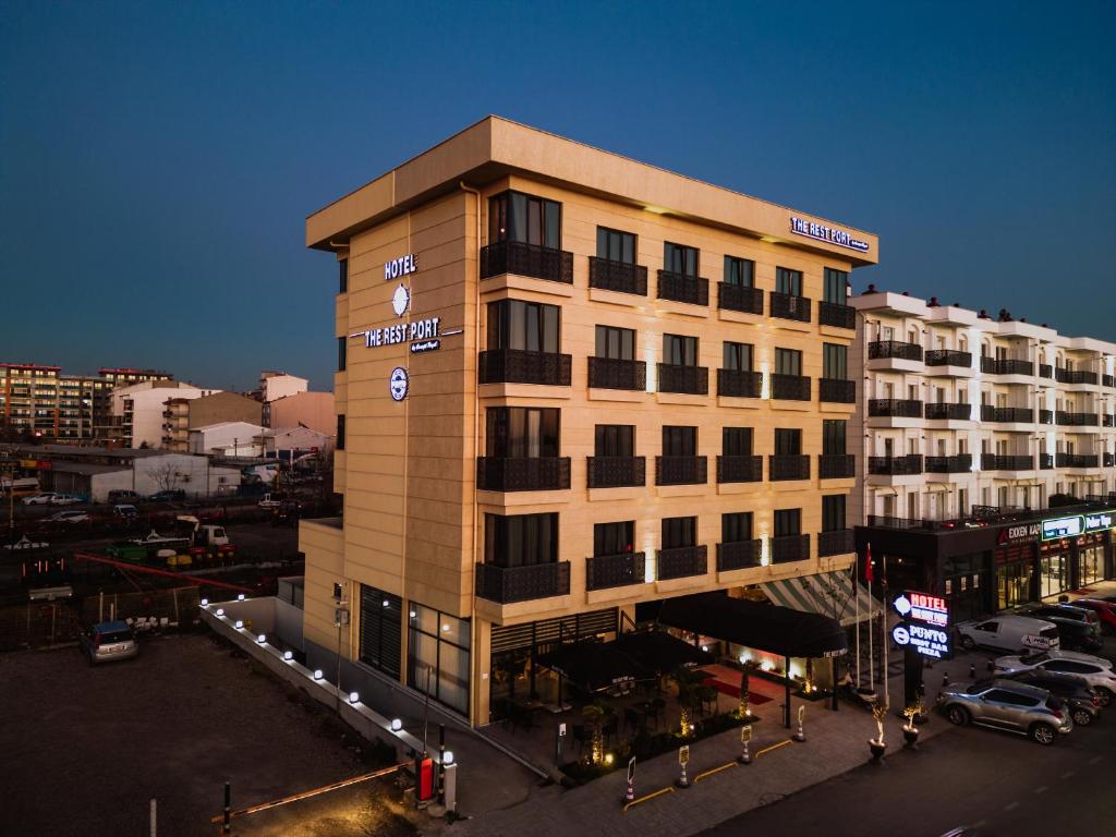 a building with a clock on it in a city at The Rest Port Hotel in Edirne