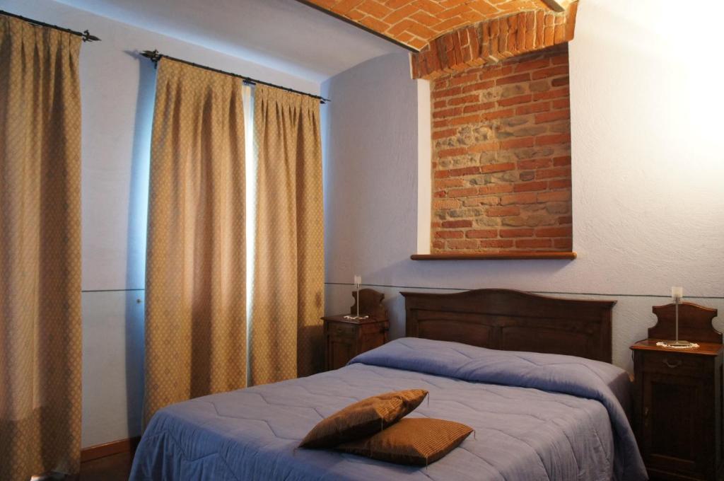 Postel nebo postele na pokoji v ubytování Red Wine Camere