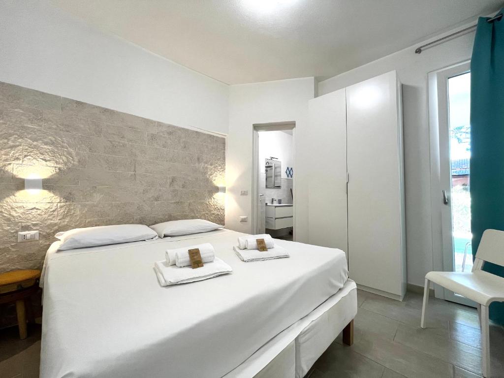 Postel nebo postele na pokoji v ubytování Angolo Mare Apartments & Rooms