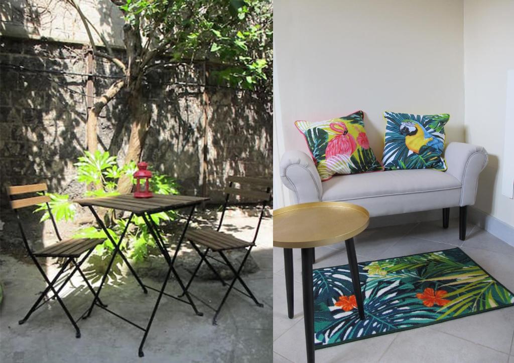 a living room with a chair and a table at Studio avec cour extérieure in Bagnolet