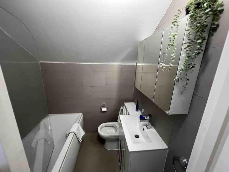 a small bathroom with a toilet and a sink at Amazing Location apartment in Maida Vale in London