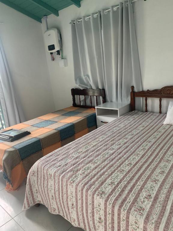 Кровать или кровати в номере Casa do paraiso