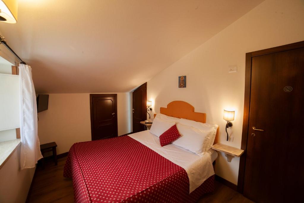 Postel nebo postele na pokoji v ubytování Hotel Pax