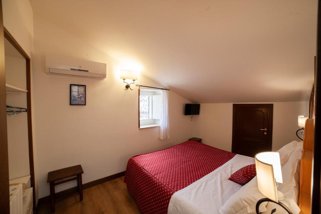 Postel nebo postele na pokoji v ubytování Hotel Pax