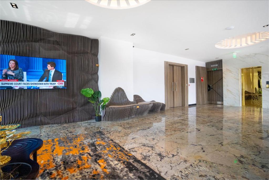 TV a/nebo společenská místnost v ubytování GTA HOTEL IKEJA