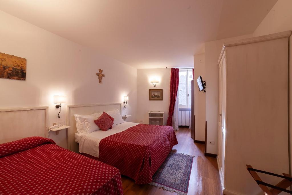 Postel nebo postele na pokoji v ubytování Hotel Pax