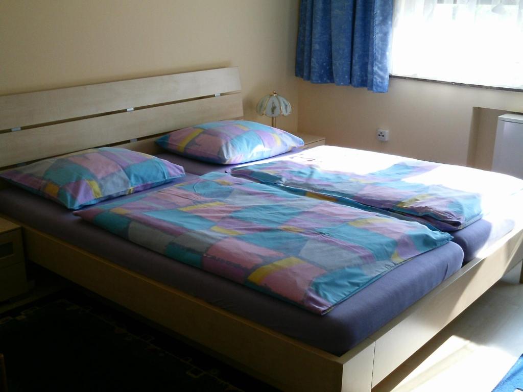 Postel nebo postele na pokoji v ubytování Gästehaus Maria