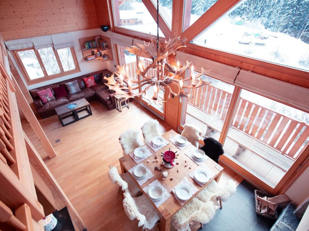 an overhead view of a living room with a table and chairs at Chalet Chalet les Pars by Interhome in Gryon