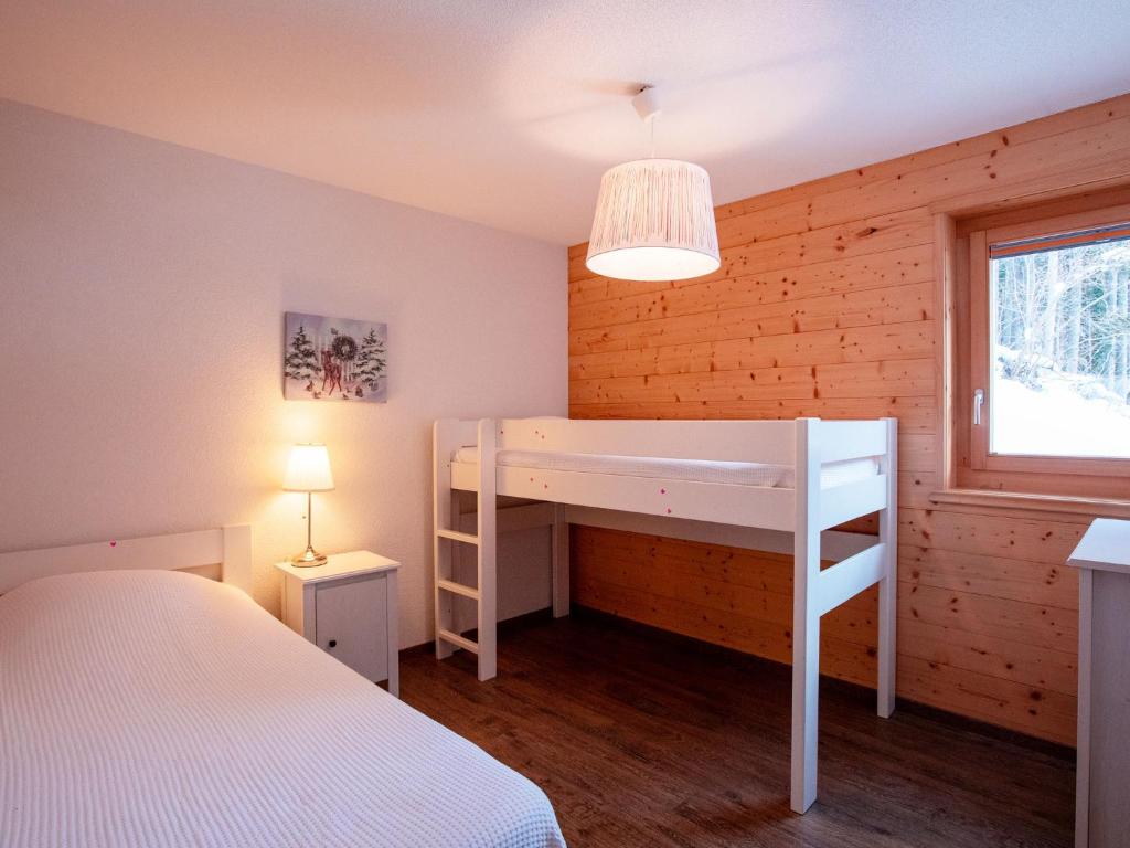 Postel nebo postele na pokoji v ubytování Chalet Chalet Les Pars by Interhome