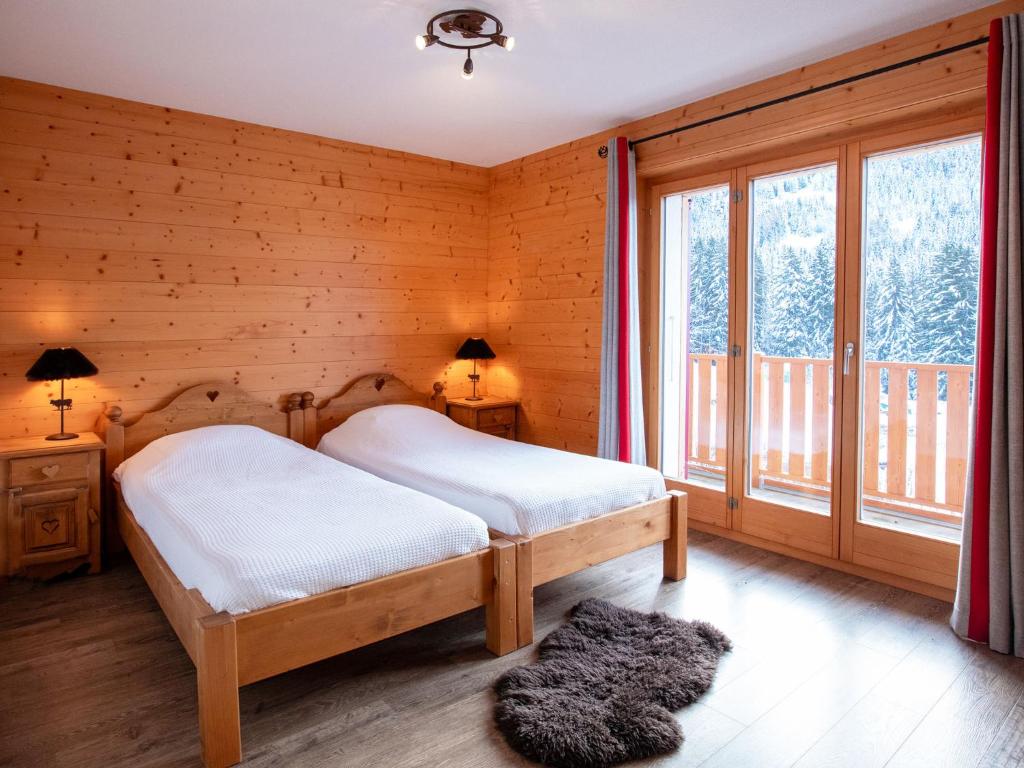 Postel nebo postele na pokoji v ubytování Chalet Chalet Les Pars by Interhome
