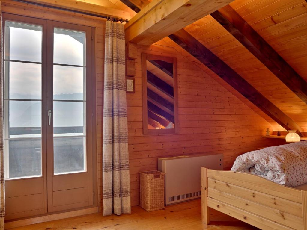 Postel nebo postele na pokoji v ubytování Holiday Home Chalet Zun by Interhome