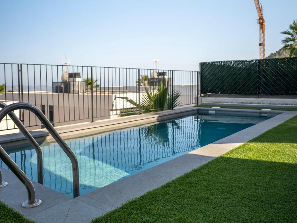 una piscina en un patio con una valla en Villa Polop HIlls by Interhome, en Polop