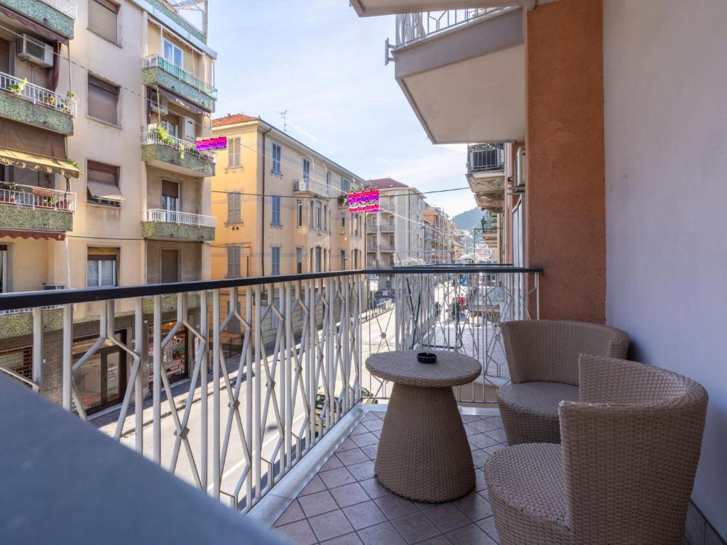 a balcony with chairs and a table on a balcony at Apartment Tobia by Interhome in Alassio