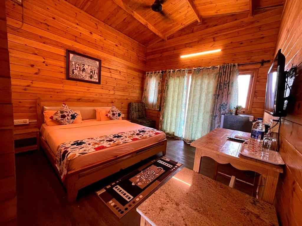 Postel nebo postele na pokoji v ubytování Obrigado Cottages