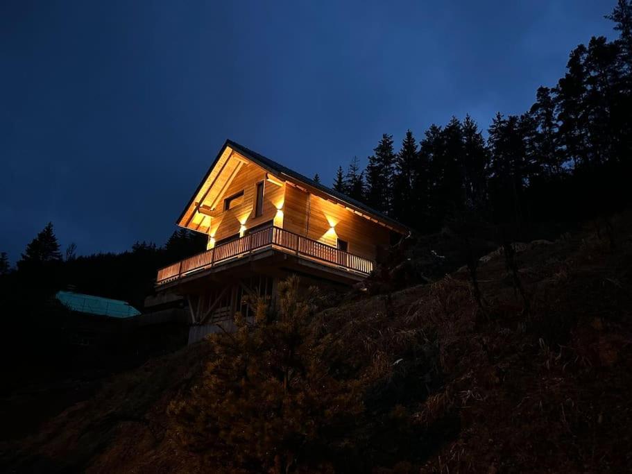 a small house on top of a hill at night at Ferienhaus am Sommerberg in Vöhrenbach