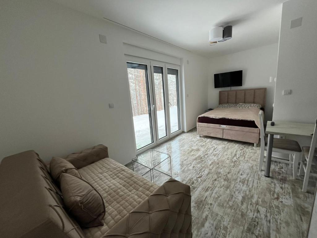 Postel nebo postele na pokoji v ubytování Apartman Leona A-1