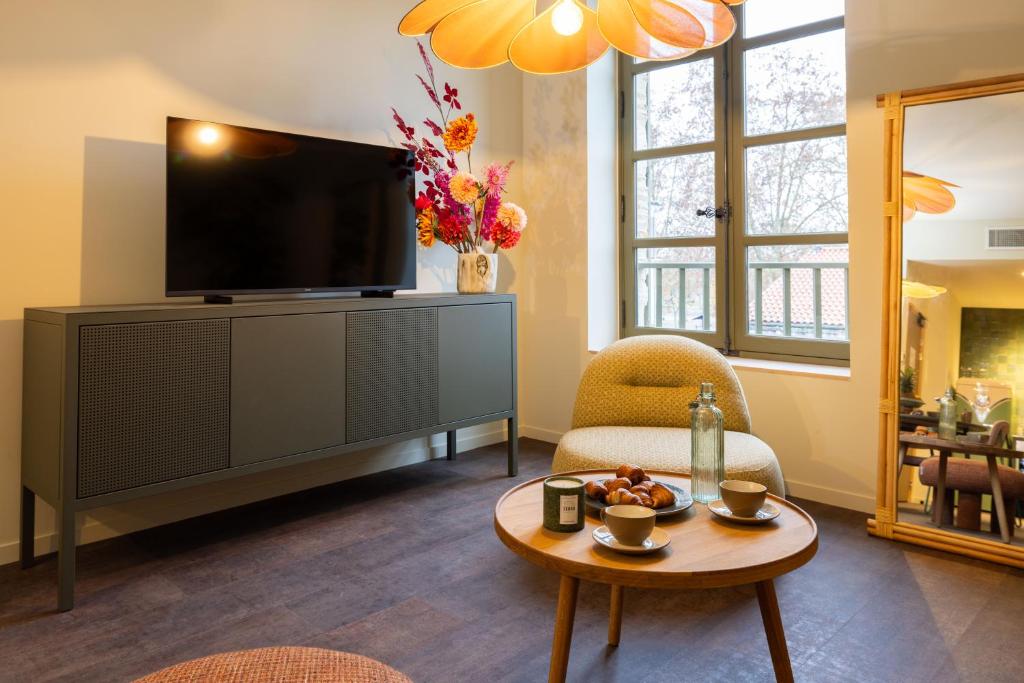 TV a/nebo společenská místnost v ubytování La Villa Serra - Appartements