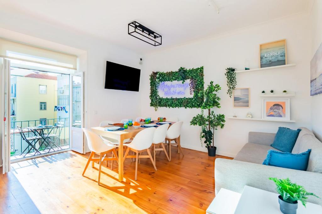 a living room with a table and a couch at Guest Inn 1 Boutique House in Lisbon