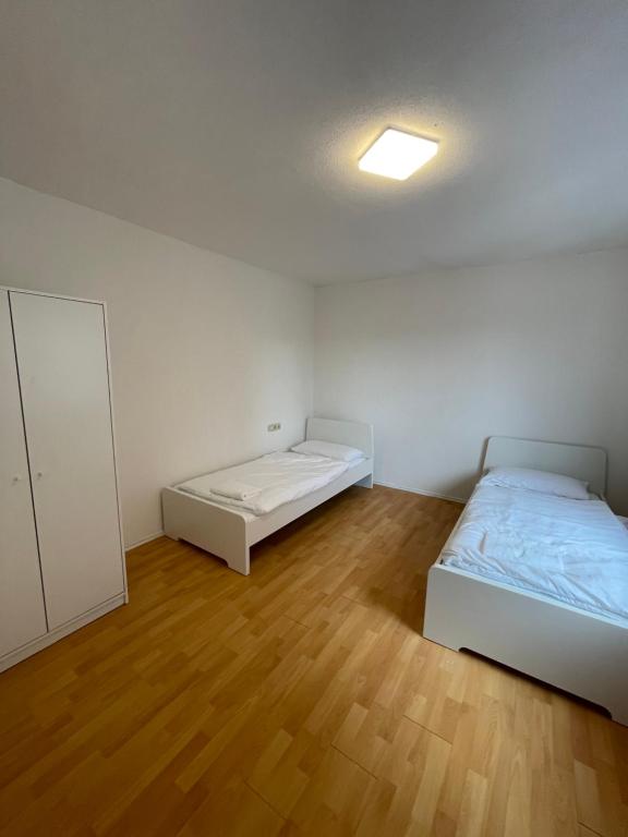a room with two beds and a mirror in it at Ferien- und Monteurswohnung in Amstetten 