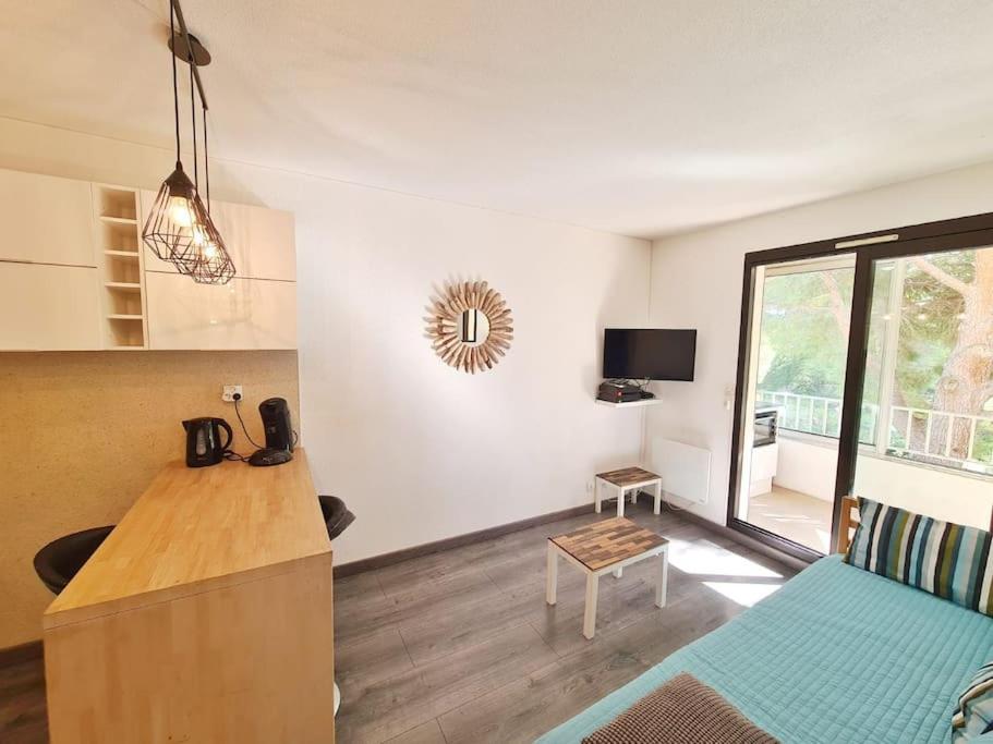 a small room with a kitchen and a living room at TLN-0013 - Domaine de la Coudoulière - Proximité plages in Six-Fours-les-Plages