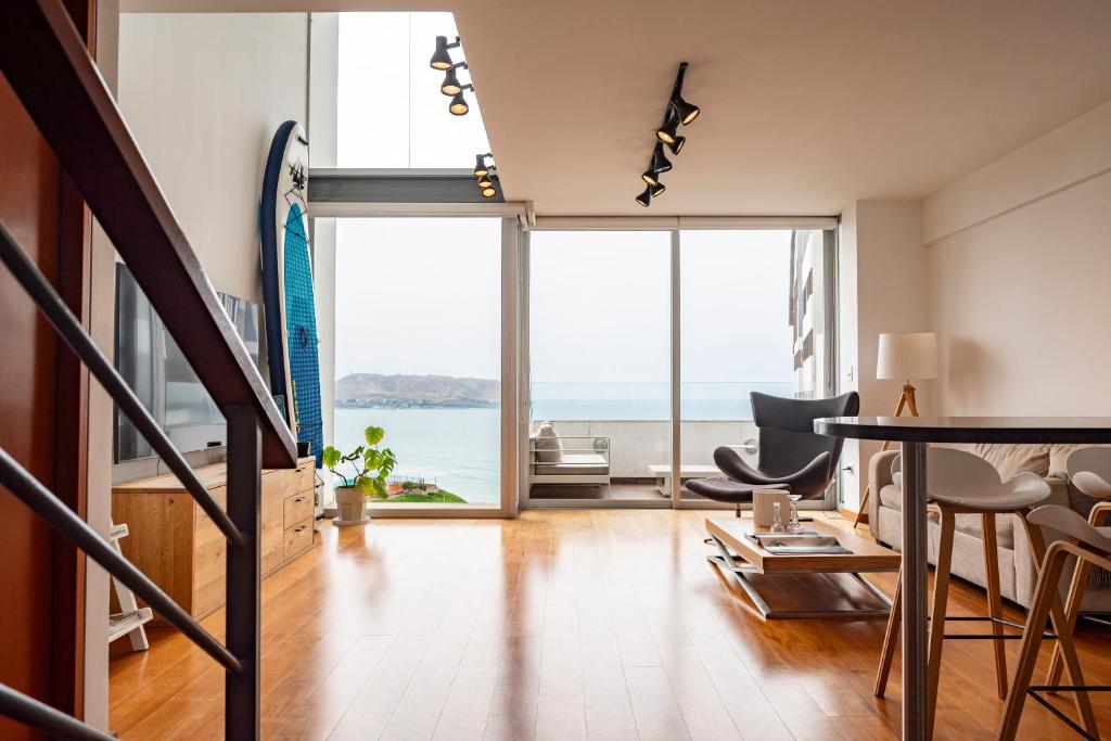 a living room with a view of the ocean at InkaHuset Miraflores Oceanfront in Lima