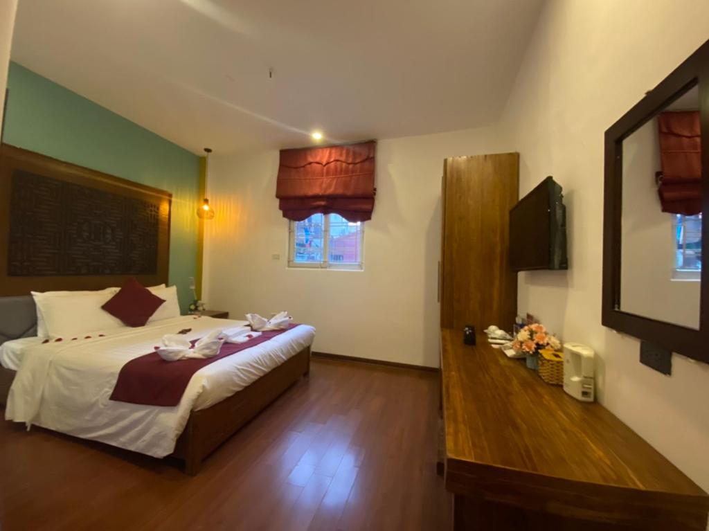 Postel nebo postele na pokoji v ubytování NT Elysian hotel