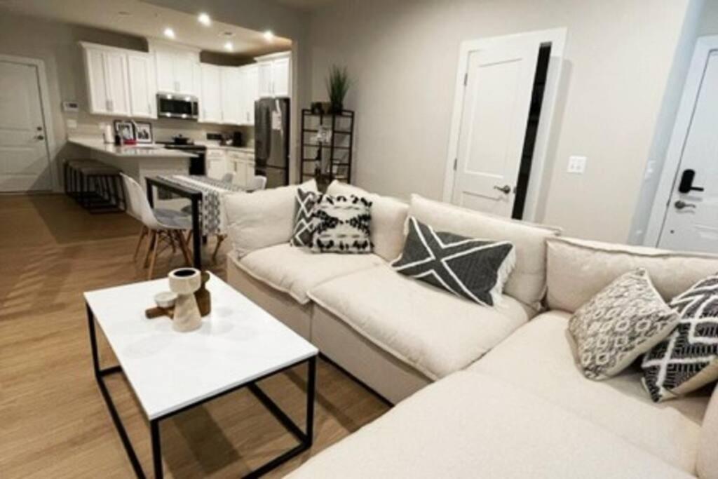 a living room with a white couch and a table at New 3BR condo near IAD airport weekly and monthly discount in Herndon