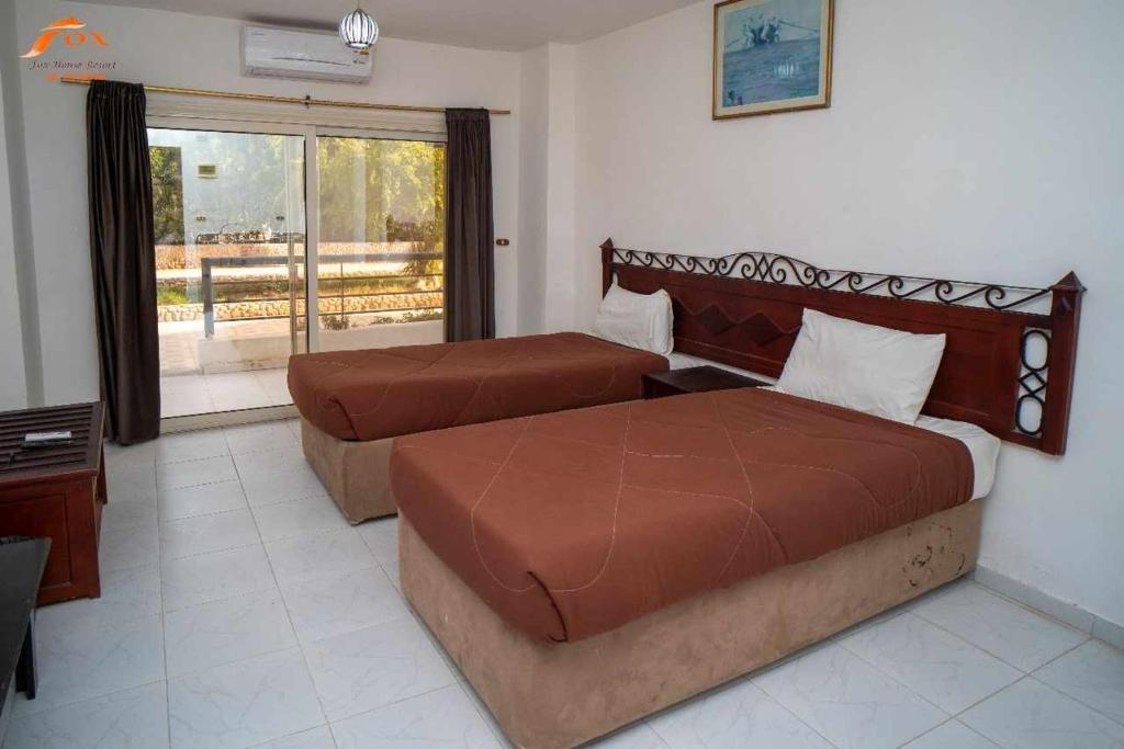 Postel nebo postele na pokoji v ubytování Fox Resort El Gouna Stay