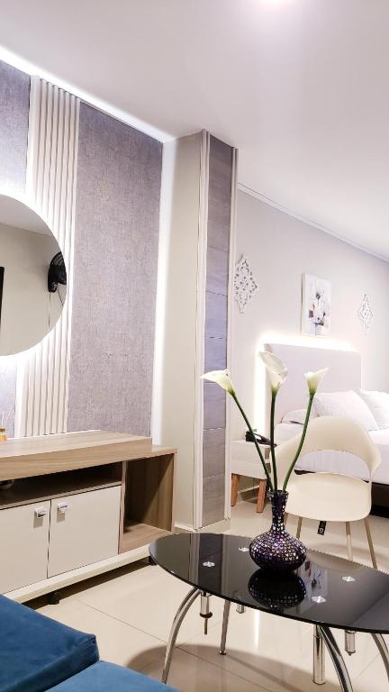 Postel nebo postele na pokoji v ubytování Hotel Suite Center Pereira