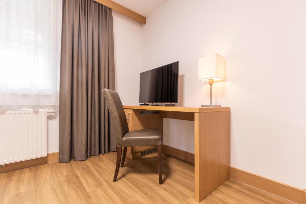 TV a/nebo společenská místnost v ubytování Hotel Castel - pure Lebensfreude