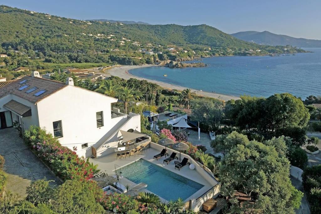 an aerial view of a house with a swimming pool at Waterfront property, pool, jacuzzi in Pietrosella