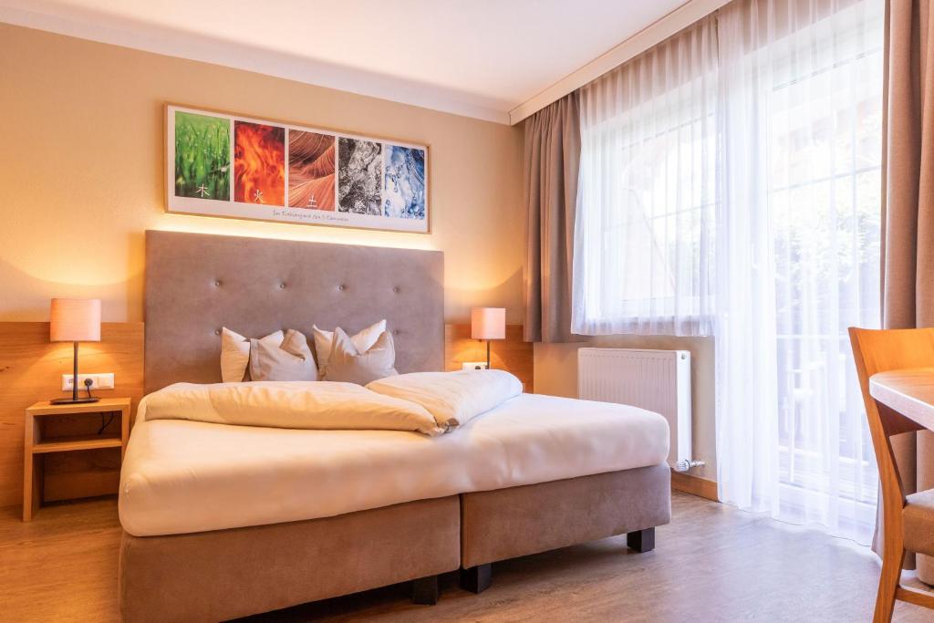 Postel nebo postele na pokoji v ubytování Hotel Castel - pure Lebensfreude
