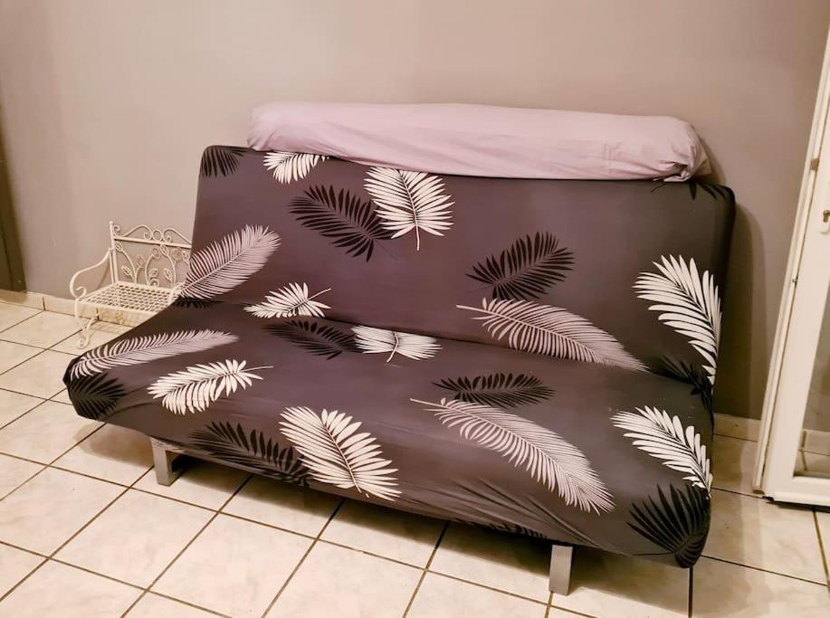 a brown bean bag chair with white leaves on it at Maison Jean Léone in Gevrey-Chambertin