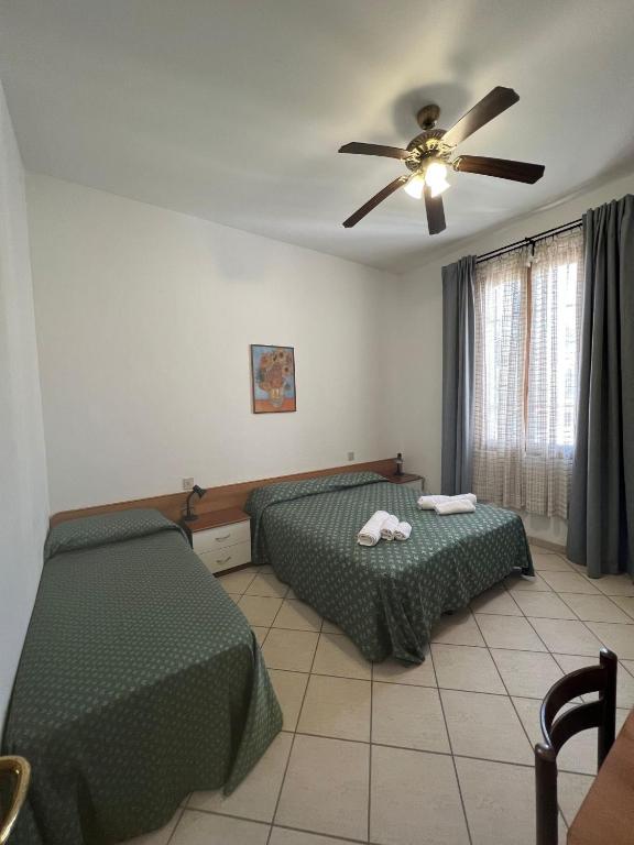 Postel nebo postele na pokoji v ubytování Hotel Rosa