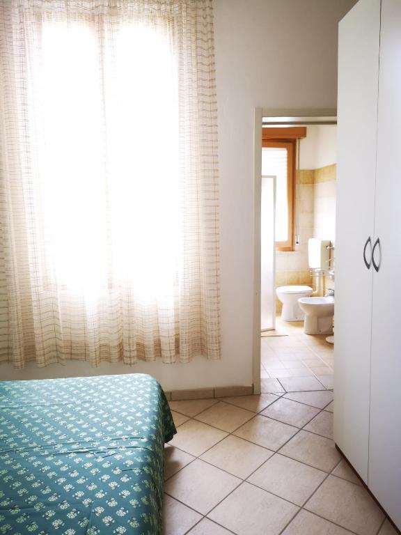 Postel nebo postele na pokoji v ubytování Hotel Rosa