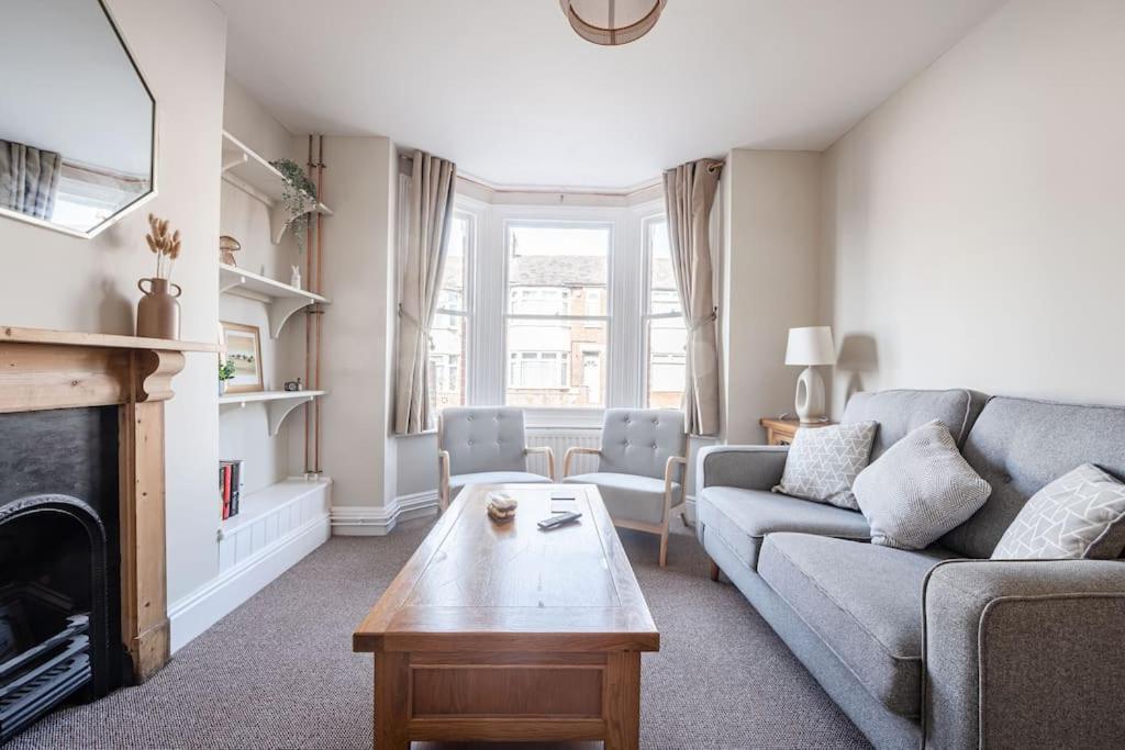 a living room with a couch and a table at Guest Homes - Sherrington Road Abode in Ipswich