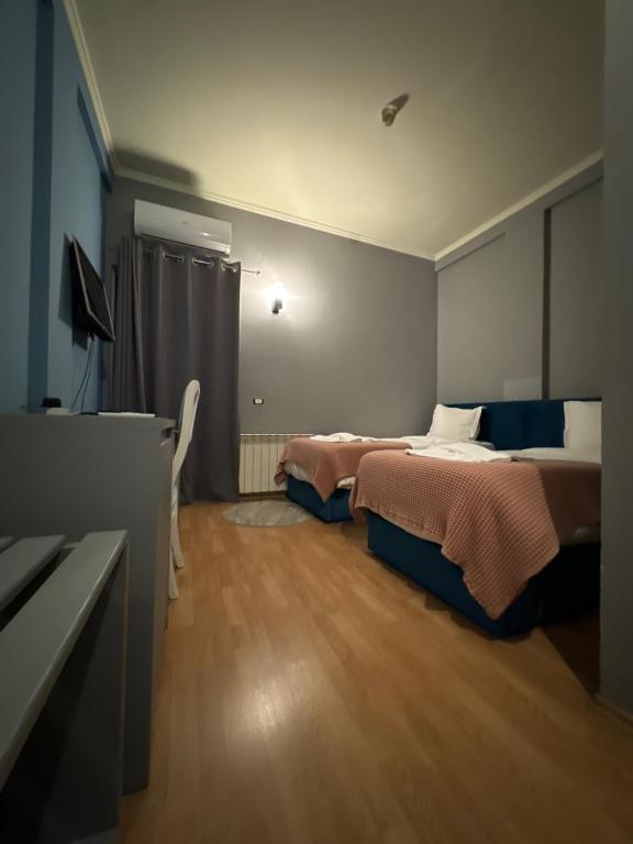 Postel nebo postele na pokoji v ubytování Hotel Tirona
