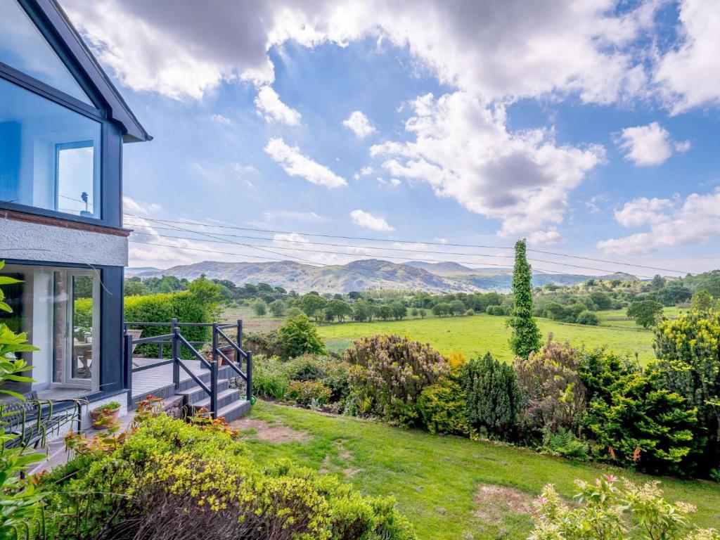 a house with a balcony with a view of a field at 3 Bed in Eskdale SZ072 in Santon Bridge