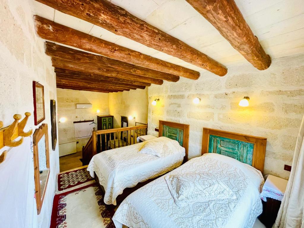 Postel nebo postele na pokoji v ubytování Sofa Hotel