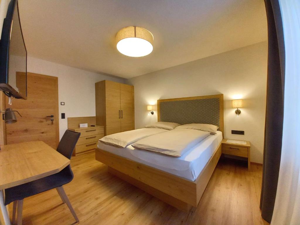 Postel nebo postele na pokoji v ubytování Gästehaus Toferer