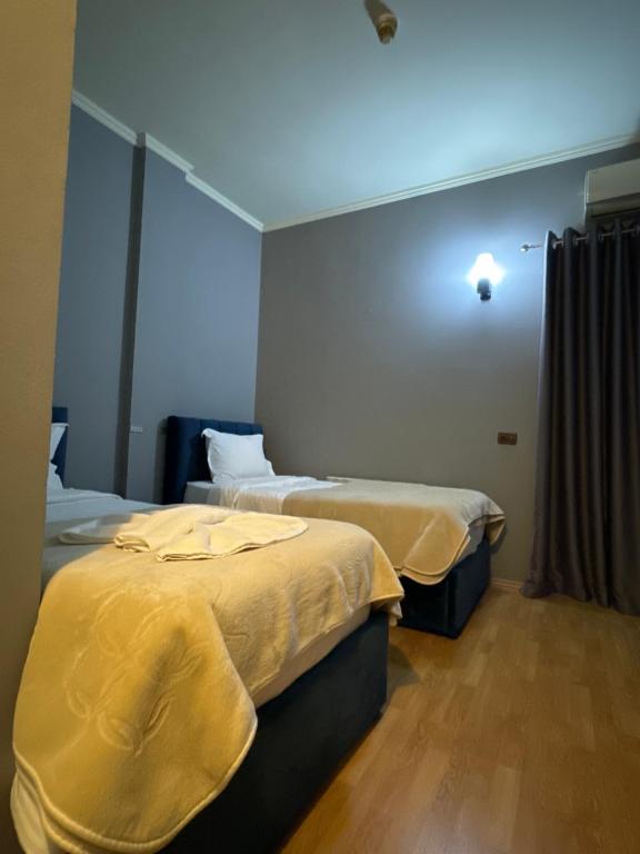 Postel nebo postele na pokoji v ubytování Hotel Tirona