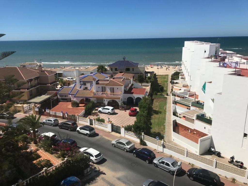 an aerial view of a city with the ocean at Beachfront 3 Bedroom Family Apartment in Matalascañas