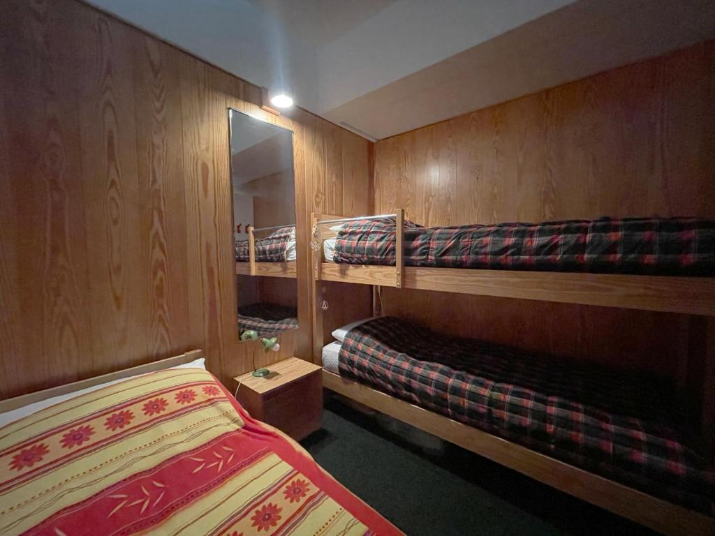 Postel nebo postele na pokoji v ubytování Appartamento Cinzia Residence Solaria Marilleva 1400