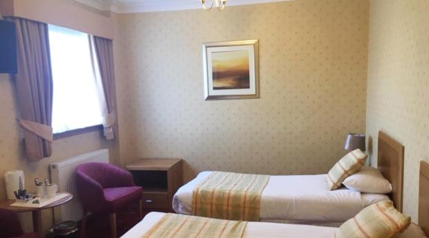 Postel nebo postele na pokoji v ubytování Leapark Hotel
