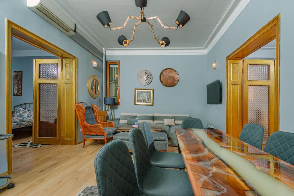 a living room with couches and a table and chairs at Top Center, 3BDR, Heart of the city, FREE Secured Parking in Sofia