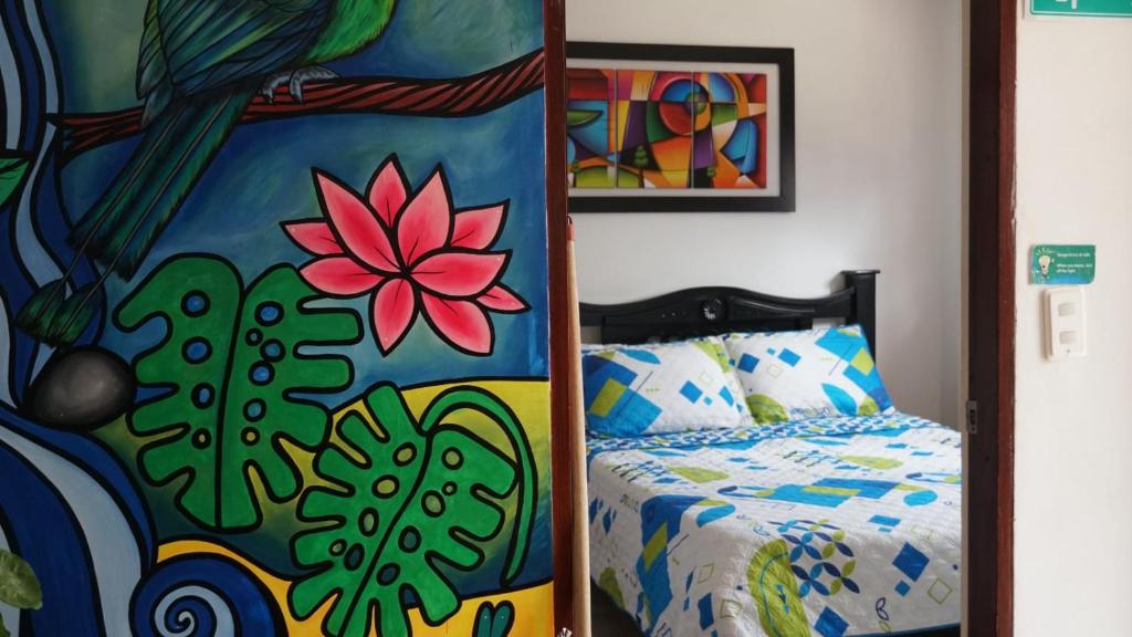 Letto o letti in una camera di Hostal Palmas De Cocora