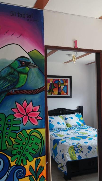 Letto o letti in una camera di Hostal Palmas De Cocora