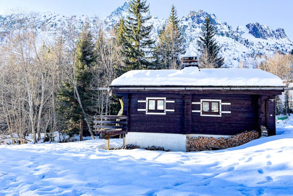 a small cabin with snow on top of it at Snowflake cottage with garden in Chamonix
